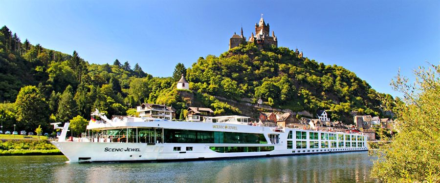 River cruise ship on the Moselle below a castle