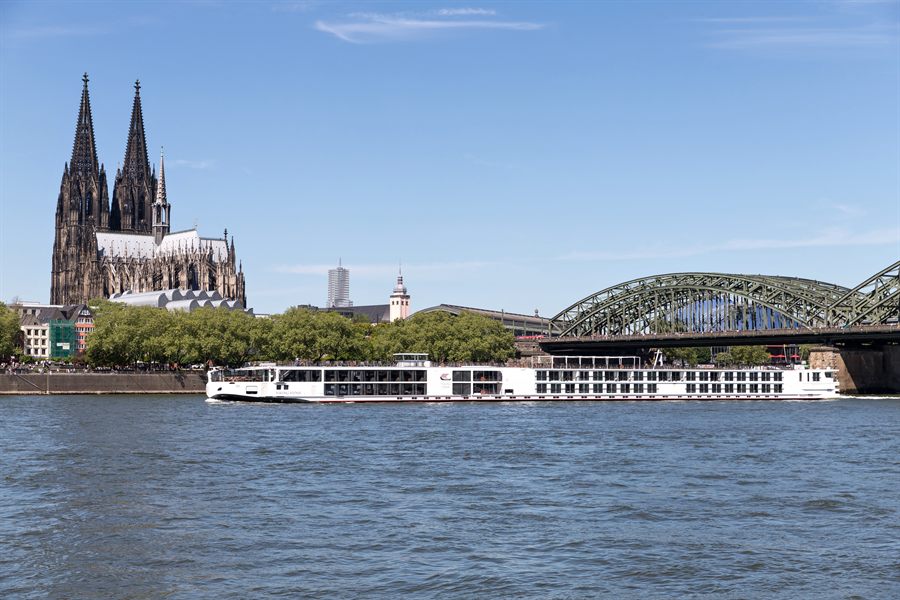 River cruise ships docked below Cologne Cathedral